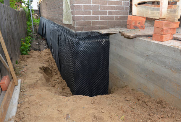 SJ Waterproofing Pros technician performing targeted Basement Waterproofing assessment in Tustin, MI